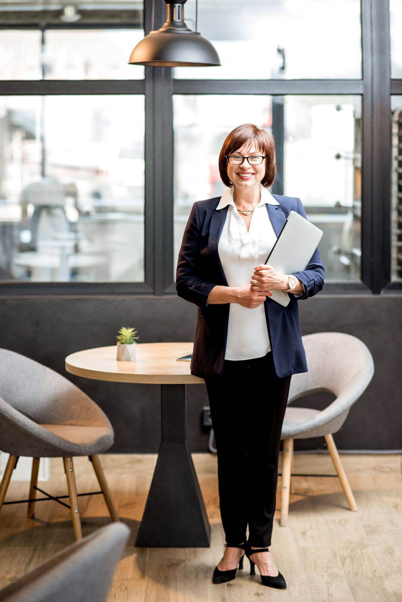 senior-business-woman-portrait-indoors-2025-03-13-03-54-37-utc.jpg